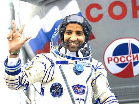 Hazza Al Mansouri gestures before his final preflight practical examination in a mock-up of a Soyuz space craft at Russian Space Training Center in Star City, outside Moscow, Russia (AP Photo/Pavel Golovkin)