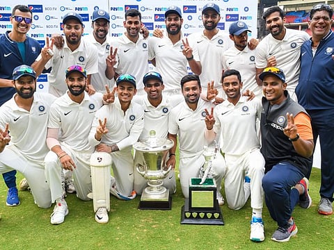 India Red players pose with the Duleep Trophy after beating India Green in the 2019-20 final on Saturday.