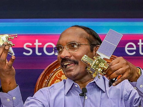 In this Aug 20, 2019 file photo, ISRO Chairman K Sivan displays a model of Chanrayaan 2 orbiter and rover during a press conference in Bengaluru. 