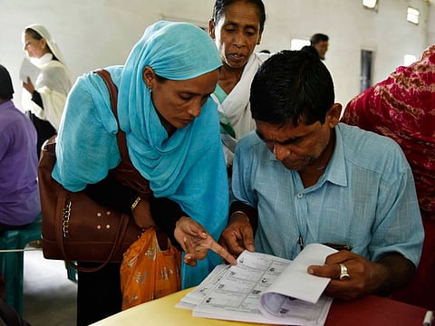 People check their names on the final list of the National Register of Citizens (NRC) at Buraburi village in Morigaon district of Assam on August 31, 2019.  