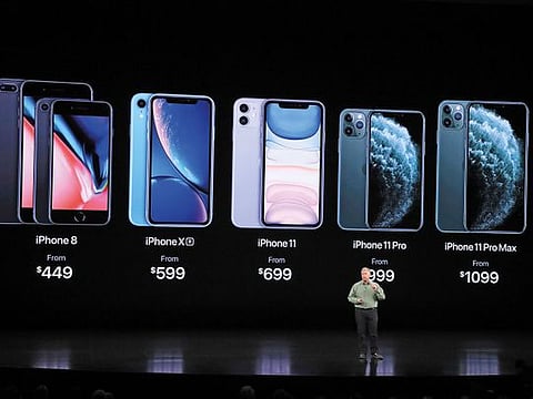Phil Schiller, Apple’s marketing vice-president, presents new iPhone models on Tuesday.