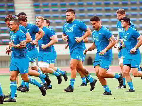 New Zealand All Blacks players Ryan Crotty (R), Codie Taylor (3rd R) and Angus Ta’avao (4th R) warm up during a training session at Kashiwanoha Park Stadium in Kashiwa, Chiba prefecture on September 11, 2019 ahead of the 2019 Rugby World Cup.