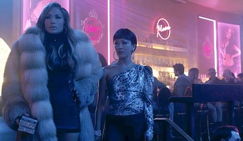 Jennifer Lopez, left, and Constance Wu star in “Hustlers.” MUST CREDIT: STX Films