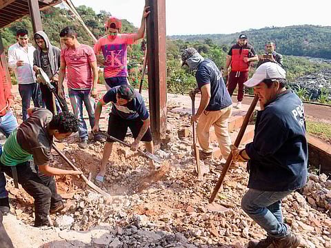 Squatters excavate an abandoned mansion of Paraguay's late dictator Alfredo Stroessner (1954-1989) in Ciudad del Este on September 13, 2019. 