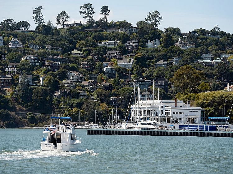 A boat motors toward the Corinthian Yacht Club in Tiburon