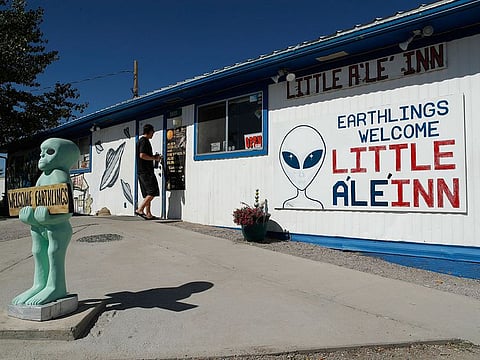 A person walks into the Little A'Le'Inn. No one knows what to expect, but lots of people are preparing for "Storm Area 51" in the Nevada desert