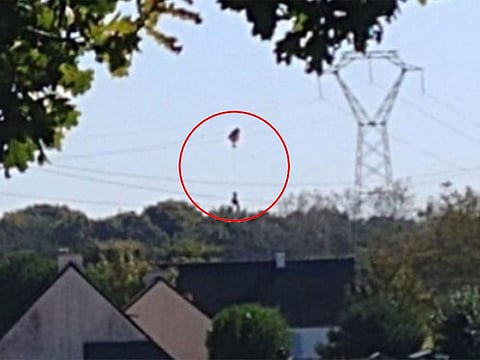 Emergency workers extracted the pilot safely after cutting off power in the area