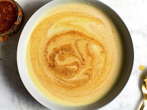 Corn soup with red pepper swirl, in New York, August, 2019. Take advantage of the late-season bounty with this slightly sweet corn soup, finished with a contrasting swirl of red pepper purée. Food Stylist: Iah Pinkney. (Andrew Scrivani/The New York Times)