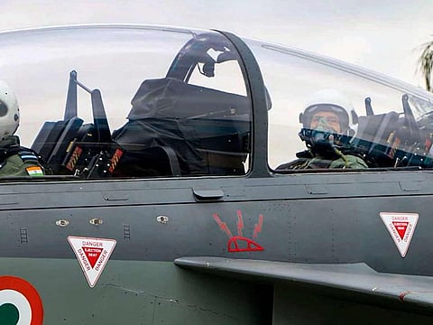 Defence Minister Rajnath Singh prepares to fly in the Tejas fighter aircraft from the HAL airport in Bengaluru. 