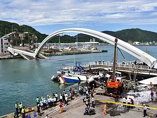 Pictures: Taiwan bridge collapse crushes fishing boats