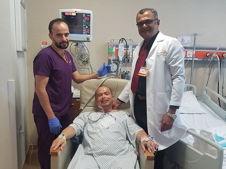 Dr Sanjay Bhat with an orderly and Johnathan 