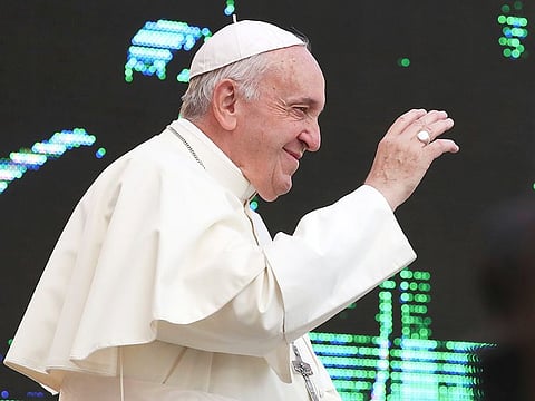 Pope Francis waves upon his arrival for the weekly general audience in St. Peter's Square at the Vatican, Wednesday, October 2, 2019. 