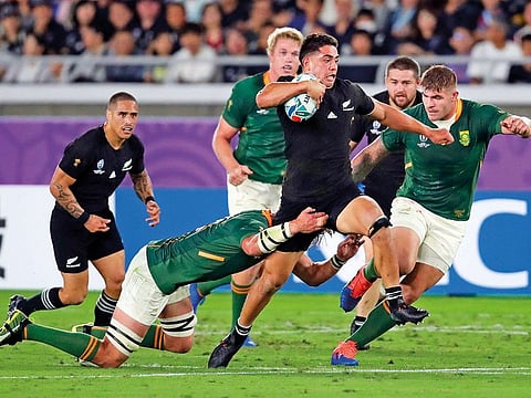New Zealand's Patrick Tuipulotu is tackled during the World Cup match against Canada.. The All Blacks defeated Canada 63-0.