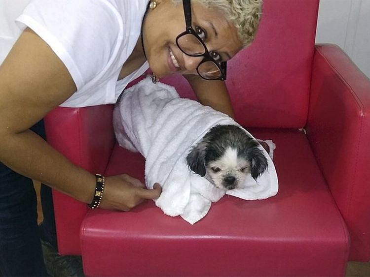 Baldera poses with her dog Virgo