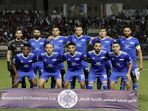 Palestinian team Hilal al-Quds players pose for a picture before their match with  Morocco's Raja Casablanca at Faisal Husseini stadium in the town of al-Ram, between Occupied Jerusalem and Ramallah, on October 3, 2019.