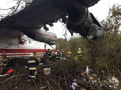 Rescuers at the plane crash site in a forest outside Lviv on October 4, 2019.   