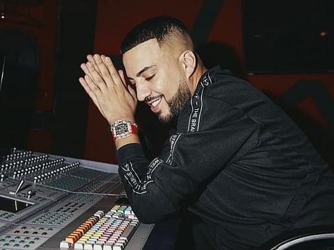 French Montana in the recording studio at his home in Calabasas, Calif., Aug. 6, 2019. The rapper, who is about to release a new studio album, says he slathers on baby oil to keep his skin soft before his old-school style workout, which includes situps, pushups and pullups. (Adam Amengual/The New York Times)