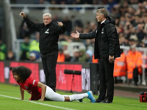  Manchester United manager Ole Gunnar Solskjaer and Newcastle United manager Steve Bruce during the Premier League clash as Manchester United's Tahith Chong looks on.