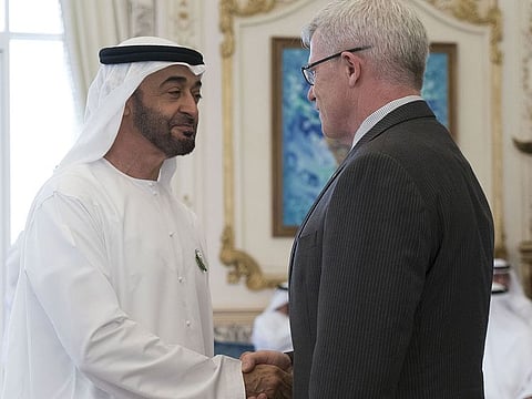 Sheikh Mohamed bin Zayed Al Nahyan, Crown Prince of Abu Dhabi and Deputy Supreme Commander of the UAE Armed Forces (L), receives a member of the International Association of Chiefs of Police, during a meeting at Al Shati Palace, Abu Dhabi. 