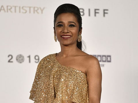 This picture taken on October 3, 2019 shows Indian film actress Tannishtha Chatterjee on the red carpet during the opening ceremony of the Busan International Film Festival (BIFF) in Busan.