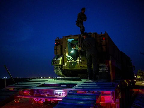 Turkish soldiers prepare an armoured vehicle as Turkish armed forces drive towards the border with Syria near Akcakale in Sanliurfa province on Tuesday.