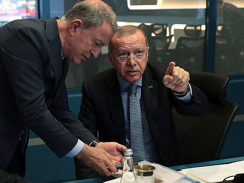 Turkish President Tayyip Erdogan is seen with Defence Minister Hulusi Akar in Ankara, Turkey