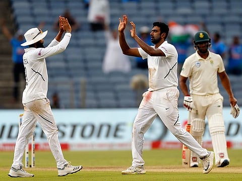 India's Ravichandran Ashwin celebrates after dismissing Kagiso Rabada.
