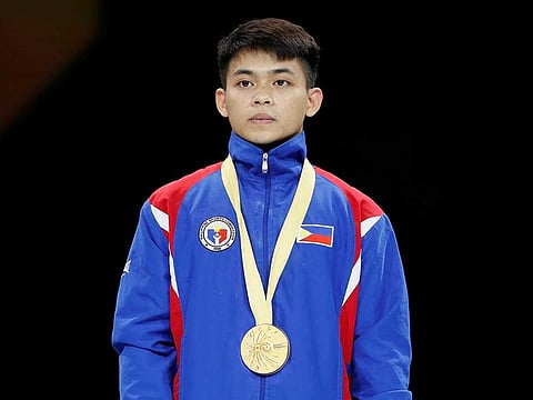 Gold medalist Philippines' Carlos Edriel Yulo during the medals ceremony.