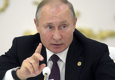 Russian President Vladimir Putin gestures while speaking at the Summit of leaders from the Commonwealth of Independent States (CIS) in Ashgabat, Turkmenistan, Friday, Oct. 11, 2019. 