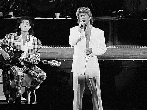 FILE - In this April 7, 1985 file photo, George Michael and Andrew Ridgeley of the British group WHAM! perform during a concert in Peking, China. (AP Photo)