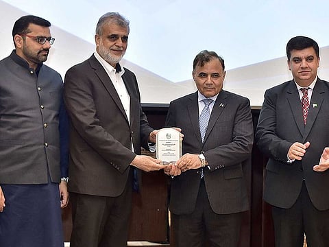 Iqbal Dawood (second from left) and Ghulam Dastgir (second from right) at the Metropolitan Hotel Dubai