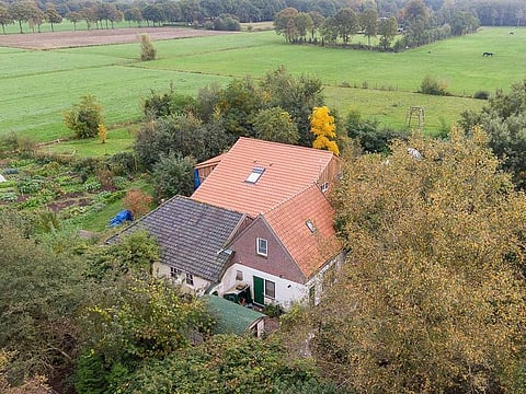 An aerial picture taken on October 15, 2019 shows a view of the farm, where a father and six children had been living in the cellar, In Ruinerwold, northern Netherlands.