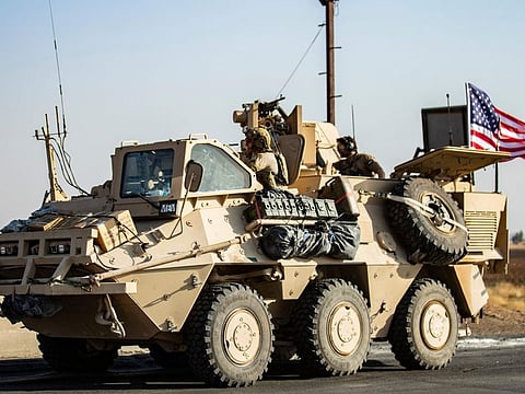 A US military vehicle patrols a road near the town of Tal Baydar in the countryside of Syria's northeastern Hasakeh province on October 12, 2019.