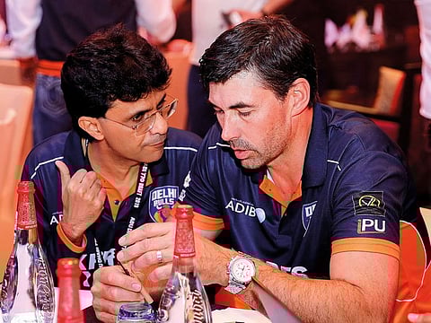 Delhi Bulls coach Stephen Fleming (right) with team mentor Anis Sajan discuss during the Abu Dhabi T10 Draft.
