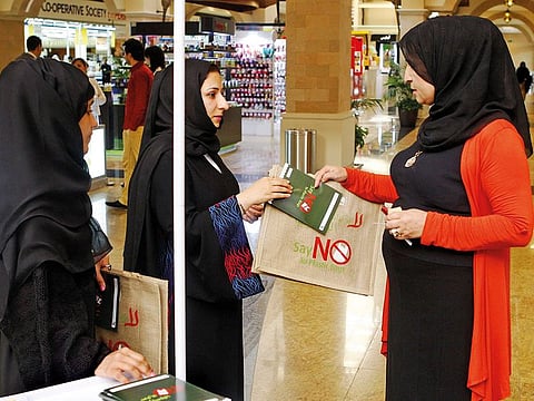 Dubai Municipality officials distributing jute bags during the launch of the “Say No To Plastic Bags?” campaign. 