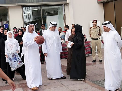 Dubai Municipality Director General Dawoud Al Hajri goes for a slam dunk 