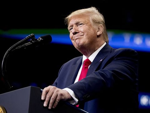President Donald Trump takes the stage at a rally at American Airlines Arena in Dallas, Texas, Thursday, Oct. 17, 2019. (AP Photo/Andrew Harnik)