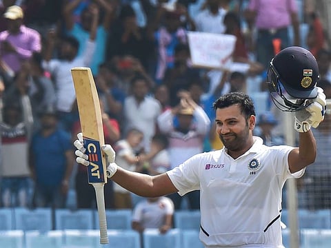 Indian opener Rohit Sharma acknowledges cheers from the crowd on reaching his maiden double century in Tests in Ranchi today.