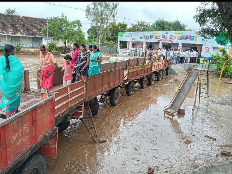 makeshift bridge of tractor-trolleys