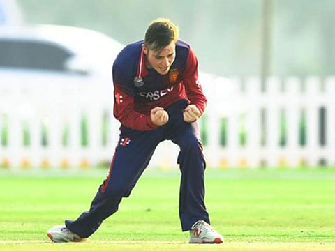 Harrison Carlyon celebrates taking a UAE wicket
