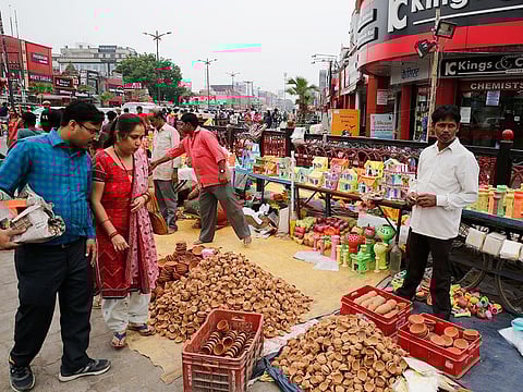A vendor sells earthen lamps ahead of Diwali, the Hindu festival of lights, in Prayagraj, India, on Friday, October 25, 2019. 