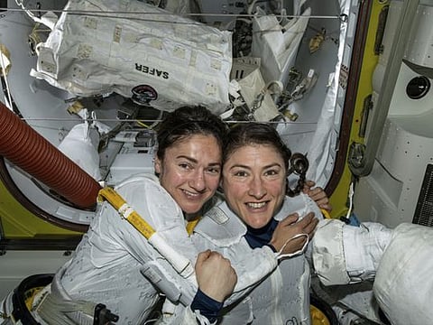In this photo released by NASA on Friday, Oct. 18, 2019, U.S. astronauts Jessica Meir, left, and Christina Koch pose for a photo in the International Space Station. The astronauts who took part in the first all-female spacewalk are still uplifted by all the excitement down on Earth. Meir said Monday, Oct. 21 that when she floated outside last week, she wasn’t thinking about whether she was going out with a man or woman because everyone is held to the same standard. Nonetheless, she says it was extra special being accompanied by Koch, a close friend.  (NASA via AP)