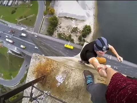 Courting danger: A dangerous selfie involving a man whose hand is being held by another person taken the selfie.