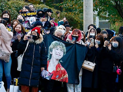 Fans of the leader of South Korean K-pop boyband BIGBANG G-Dragon gather outside an army base as they wait for him being discharged from army in Yongin, South Korea, October 26, 2019.   REUTERS/Heo Ran