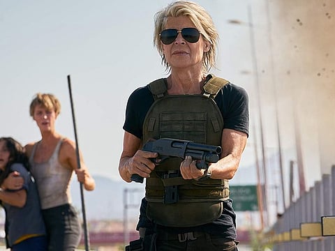 Linda Hamilton in "Terminator: Dark Fate." In the background are Natalia Reyes and Mackenzie Davis. (Paramount Pictures)