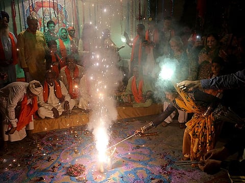 Hindu families participate in a ceremony to celebrate Diwali, the festival of lights, at a temple in Lahore, Pakistan.