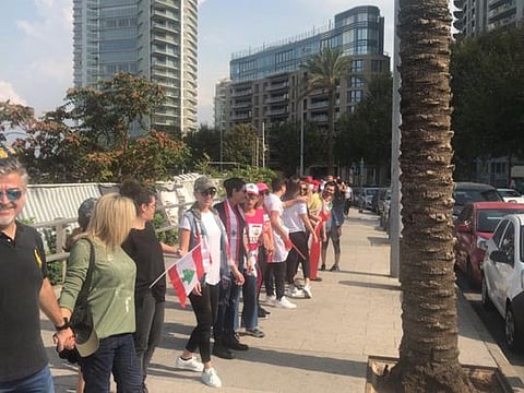 Lebanese gather to form human chain.