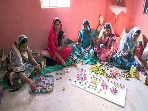 Women of self help groups making eco-friendly cow dung diyas in Raipur, Chhattisgarh.