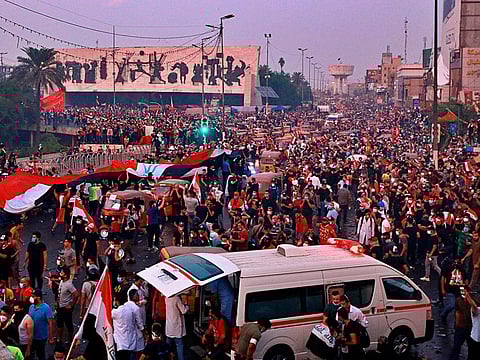 Anti-government protesters gather in Tahrir Square during a demonstration in Baghdad, Iraq, Monday, Oct. 28, 2019. 
