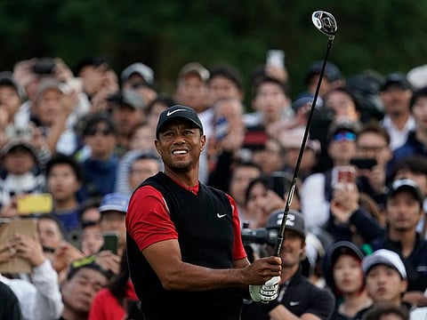 Tiger Woods on his way to victory in Japan.
